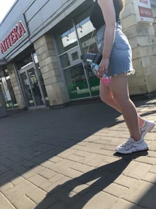 Hot chick wearing a fringed skirt walking up the stairs