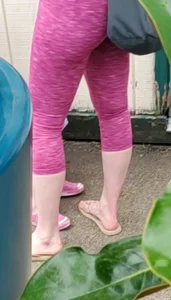 Milf shopping with a nice ass in tight maroon leggings
