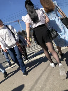 Skinny candid teen wearing shorts and black pantyhose crossing the street