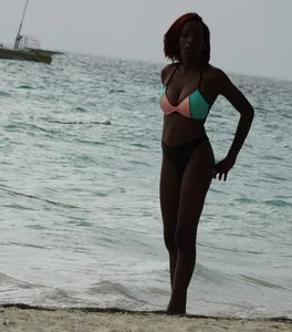 Candid black family, milf and teens on the beach in bikinis