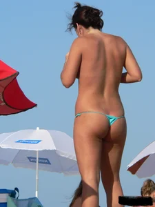 2 topless thonged sexy friends on the beach with great bodies