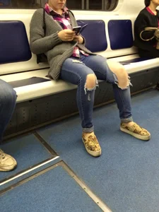 Girl with Sexy Torn Jeans in a Subway Train Candid