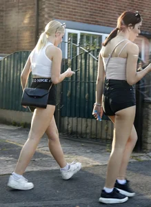Pair of oblivious teens in short shorts