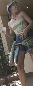 Tatted up hippie in short jean shorts with a nip slip