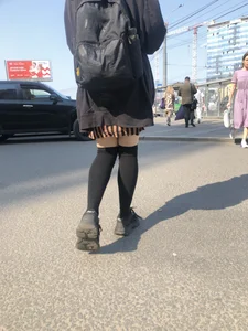 Legs in Knee-Socks And a Skirt - Young Girl Passing By on the Street