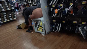 Brown shorts vtl trying on shoes