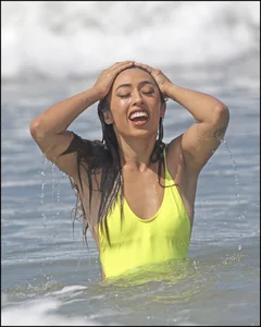 Sexy ass beach babe in a yellow thong swimsuit
