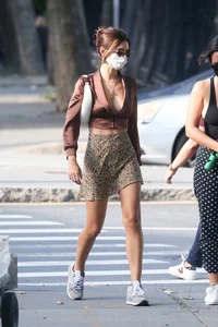 Emily Ratajkowski in mini skirt out for a walk with a friend in New York