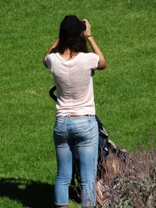 Skinny milf in tight jeans showing a bit of ass crack