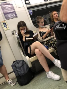 Cute Girl in a Mask With Sexy Legs Reading in a Subway Train Creepshots Gallery