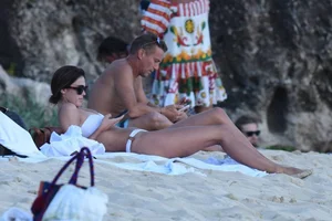 Iris Mittenaere in a white thong bikini on the beach in St Martin