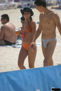 A bunch of sexy beach voyeur babes in bikinis, thongs and topless