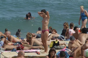 Topless girls on a beach in Barcelona