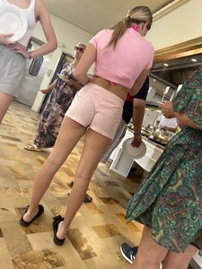 Hot teen chick wearing a pink top and shortrs creepshots, amazing long legs