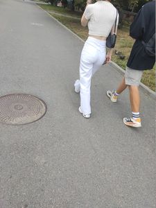 Sexy GF in tight white pants with a very hot ass walking down the street creepshot