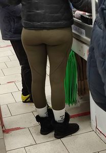 Blonde milf with a big hot butt in green leggings at the supermarket creepshots