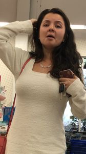 Busty brunette beauty in a fuzzy dress