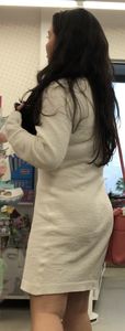 Busty brunette beauty in a fuzzy dress
