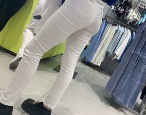Tight white jeans and leggings ass in line