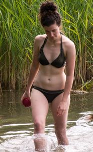 Cute girl in a swimsuit at the lake