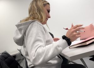Following the blonde with Fake lashes in green leggings