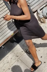 Sexy braless ebony babe in tight skirt with pokies