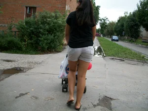 Young Milf in Shorts and Slippers Suburban Street Photos