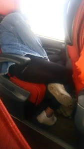Girl in Leggings Asleep in a Bus