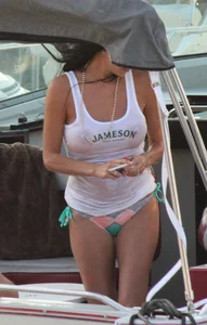 Bikini babe on a boat with a wet see through white shirt showing her tits