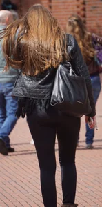 Pretty girl walking in tight black pants