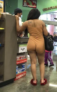 Latina with hard nipples and a big booty in tight spandex shorts outfit