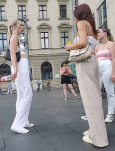 Long blonde braless in a white outfit (many pictures)