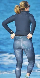 Beach redhead milf in patterened leggings at the beach
