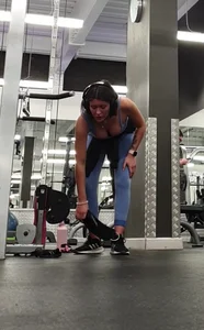 Bending gym babe stern face