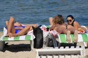 A couple sexy girls laying out on the beach