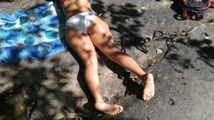 Sexy bikini ass laying out on the rocks up close
