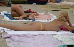 Beach voyeur girls in bikinis, thongs and topless