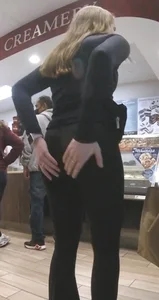 Teen in leggings holding her booty
