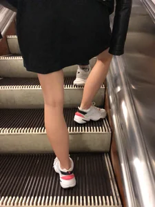 Blonde in a Dress and Sneakers With Sexy Skinny Legs in the Subway Train and on the Escalator Closeup Candid Photos