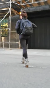 Black spandex and little grey boots crossing the street - such a cutie