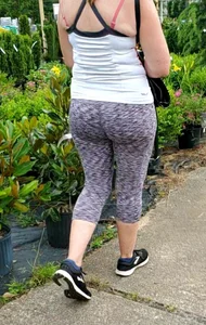 Milf booty in tight leggings shopping for plants