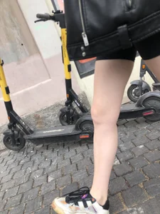 Very hot legs of a candid girl wearing a leather jacket