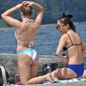 Blondie and two asian girls put on sunscreen (pt 2) [062]