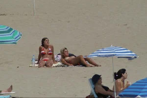 Girls on a nude beach in Sitges, Spain