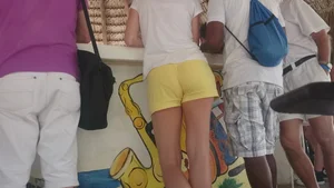 Milf in yellow shorts with vpl and a wedgie