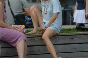 Blonde milf upskirted showing white panties and some pubes