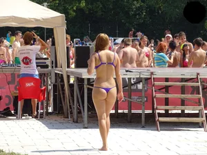 Hot ass babe in a blue thong bikini at the pool
