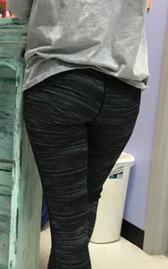 Ass standing around in tight grey patterned leggings