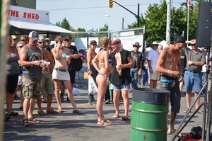 Hot ass Canadian babe in a bikini dancing at a concert