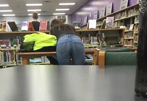 Girl in Tight Jeans Bend Over Desk in the Public Library Candid Photo